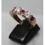 A RUBY AND DIAMOND HALF HOOP ETERNITY RING, the three rubies and three diamonds point set to a plain