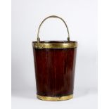 A GEORGIAN MAHOGANY AND BRASS BOUND PEAT BUCKET, late 18th century, of coopered construction with