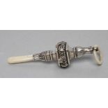 AN EDWARDIAN SILVER RATTLE, maker Crisford & Norris, Birmingham 1907, of square baluster form