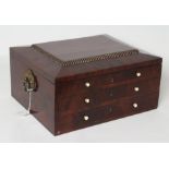 A REGENCY MAHOGANY WORK BOX, of oblong form with gilded brass ring handles, the mildly domed