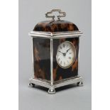 A SILVER MOUNTED TORTOISESHELL CARRIAGE CLOCK, maker Carringtons Co., London 1914, the circular