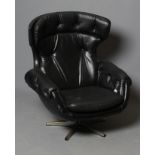 A SWIVEL ARMCHAIR, mid 20th century, button upholstered in black leatherette, on a chrome plated