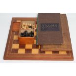 A TURNED WOOD CHESS SET in natural and stained black, king 3 2/8" high, in a mahogany box with