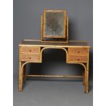 A BAMBOO AND WICKER DRESSING TABLE, c.1900, with inset glass top, the kneehole flanked by a cupboard