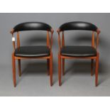 A PAIR OF TEAK ELBOW CHAIRS, mid 20th century, the open padded cow horn back and seat in black