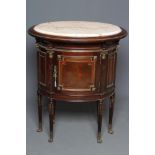 A FRENCH EMPIRE STYLE MAHOGANY CABINET, 20th century, of oval panelled form with gilt metal