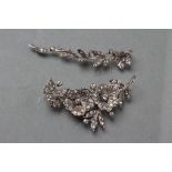 A MID CENTURY PASTE AND SILVER TWO PIECE BROOCH, the double flower head stem with pin and loop