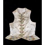 A REGENCY GENTLEMAN'S CREAM SILK WAISTCOAT, c.1790, embroidered in coloured silks with flower