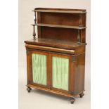 A REGENCY ROSEWOOD CHIFFONIER, the two tier panelled shelved upper section with gadrooned edging and