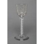 A CORDIAL GLASS, mid 18th century, the ogee bowl wheel engraved with vines on an opaque twist stem