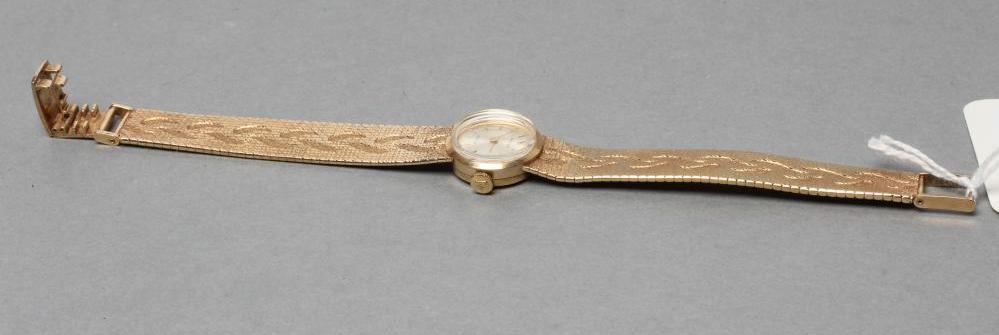 A LADY'S 9CT GOLD ROLEX WRISTWATCH, the champagne dial with gilt metal batons, the eight jewel - Image 3 of 4