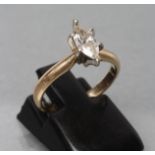 A SOLITAIRE DIAMOND RING, the marquise cut stone of 0.46cts claw set to a plain shank, stamped