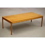 A NORWEGIAN TEAK COFFEE TABLE, mid 20th century, the moulded edged rounded oblong top and plain