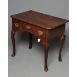 A GEORGIAN OAK LOWBOY, late 18th century, the moulded edged and cusped cornered top over scrolled