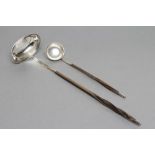 A LATE GEORGE III PUNCH LADLE, maker probably E. Morley, London 1789, the plain oval bowl with