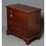 A SMALL GEORGIAN MAHOGANY STRAIGHT FRONT CHEST, late 18th century, the moulded edged top over four