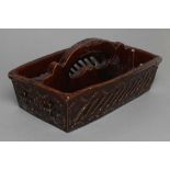 AN ENGLISH TREACLE GLAZED STONEWARE SLAB BUILT CUTLERY TRAY, mid 19th century, of plain oblong form,