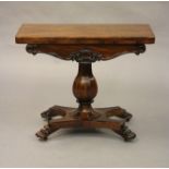 AN EARLY VICTORIAN ROSEWOOD CARD TABLE, the banded rounded oblong top opening to a circular green