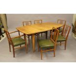 A GORDON RUSSELL OF BROADWAY TEAK DINING TABLE AND CHAIRS, the tapering oblong extending table
