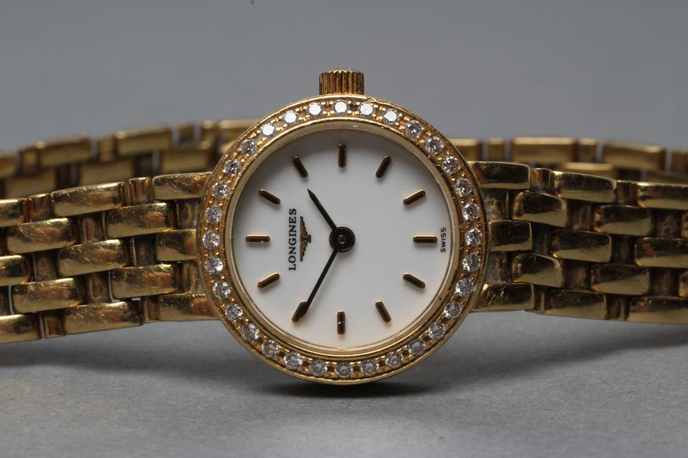 A LADY'S LONGINES 18CT GOLD AND DIAMOND WRISTWATCH, the white dial with gilt batons, the quartz five - Image 4 of 4