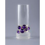 A WENDY RAMSHAW SILVER AND AMETHYST STACKING RING, the six plain rings each set with a graduated