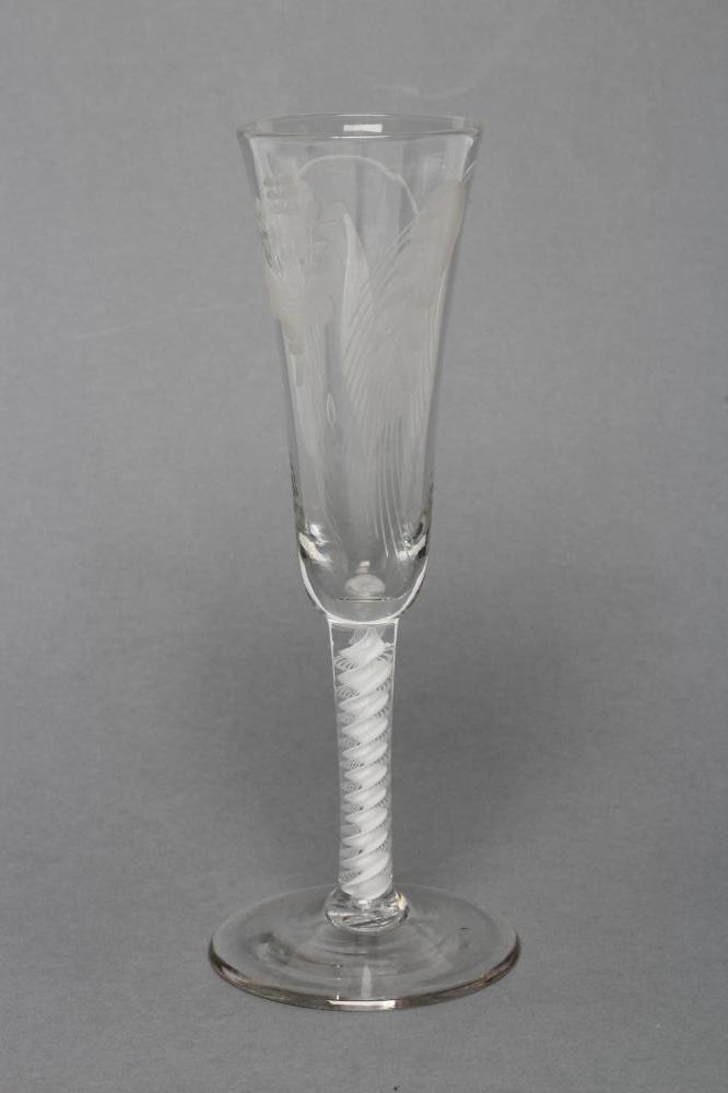 AN ALE GLASS, mid 18th century, the round funnel bowl wheel engraved with ears of barley on an