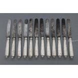 A SET OF TWELVE WILLIAM IV DESSERT KNIVES, maker's mark SP, London 1837, the reeded stamped and