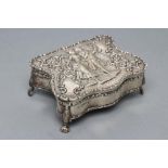 AN EDWARDIAN SILVER DRESSING TABLE BOX, maker's mark indistinct, Chester 1909, of serpentine form