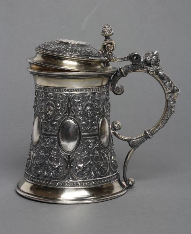 A RUSSIAN TANKARD, post 1876, 84 standard, of swept cylindrical form chased with six vacant oval