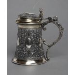 A RUSSIAN TANKARD, post 1876, 84 standard, of swept cylindrical form chased with six vacant oval