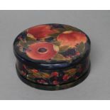 A MOORCROFT POTTERY POMEGRANATE PATTERN LARGE BOX AND COVER, early 20th century, of plain