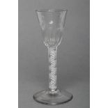 A WINE GLASS, mid 18th century, the semi-wrythen mould blown round funnel bowl on an opaque twist