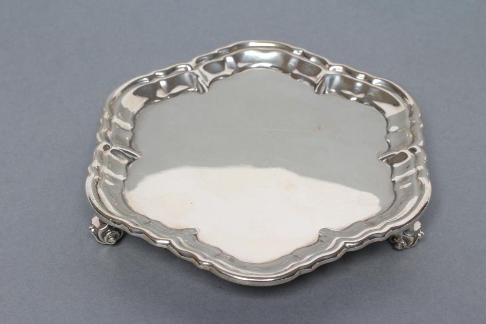 A LATE VICTORIAN WAITER, maker Huttons, London 1895, of shaped circular form with pie-crust rim,