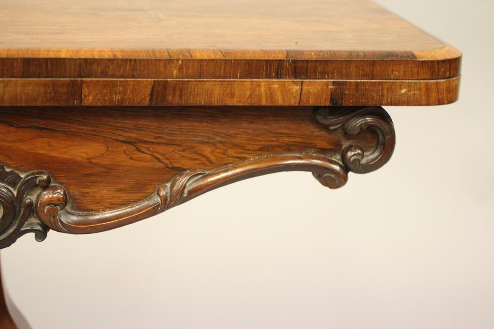 AN EARLY VICTORIAN ROSEWOOD CARD TABLE, the banded rounded oblong top opening to a circular green - Image 3 of 5