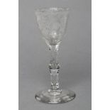 A WINE GLASS, mid 18th century, the round funnel bowl wheel engraved with three sprays of flowers