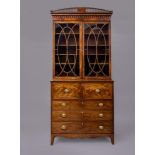 A GEORGIAN MAHOGANY SECRETAIRE BOOKCASE, c.1800, with rosewood banding and stringing, the lambrequin