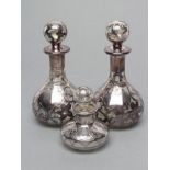 A PAIR OF AMERICAN CLEAR GLASS SCENT BOTTLES AND STOPPERS, early 20th century, of baluster form with