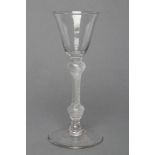 A CORDIAL GLASS, mid 18th century, the round funnel bowl on shoulder knop and multi-spiral air twist