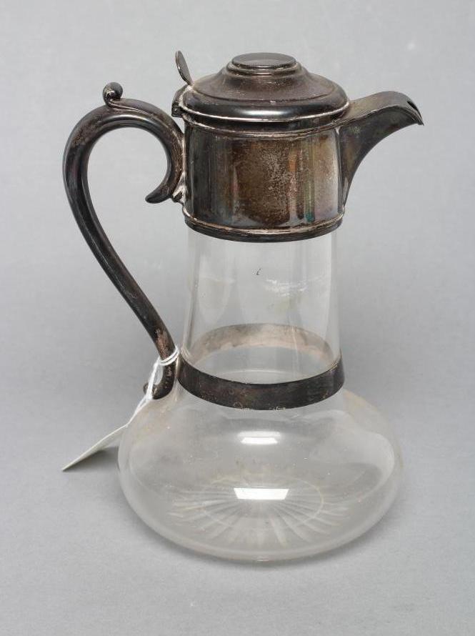 A LATE VICTORIAN GLASS CLARET JUG, maker H. Woodward & Co. Ltd, London 1894, with bulbous star cut