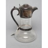 A LATE VICTORIAN GLASS CLARET JUG, maker H. Woodward & Co. Ltd, London 1894, with bulbous star cut