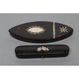 A GEORGIAN TORTOISESHELL PATCH BOX of navette form, the flat hinged cover with silver pique work