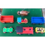 Lot of wooden toys including two tractors, four trailers and a wooden cat puppet.Condition