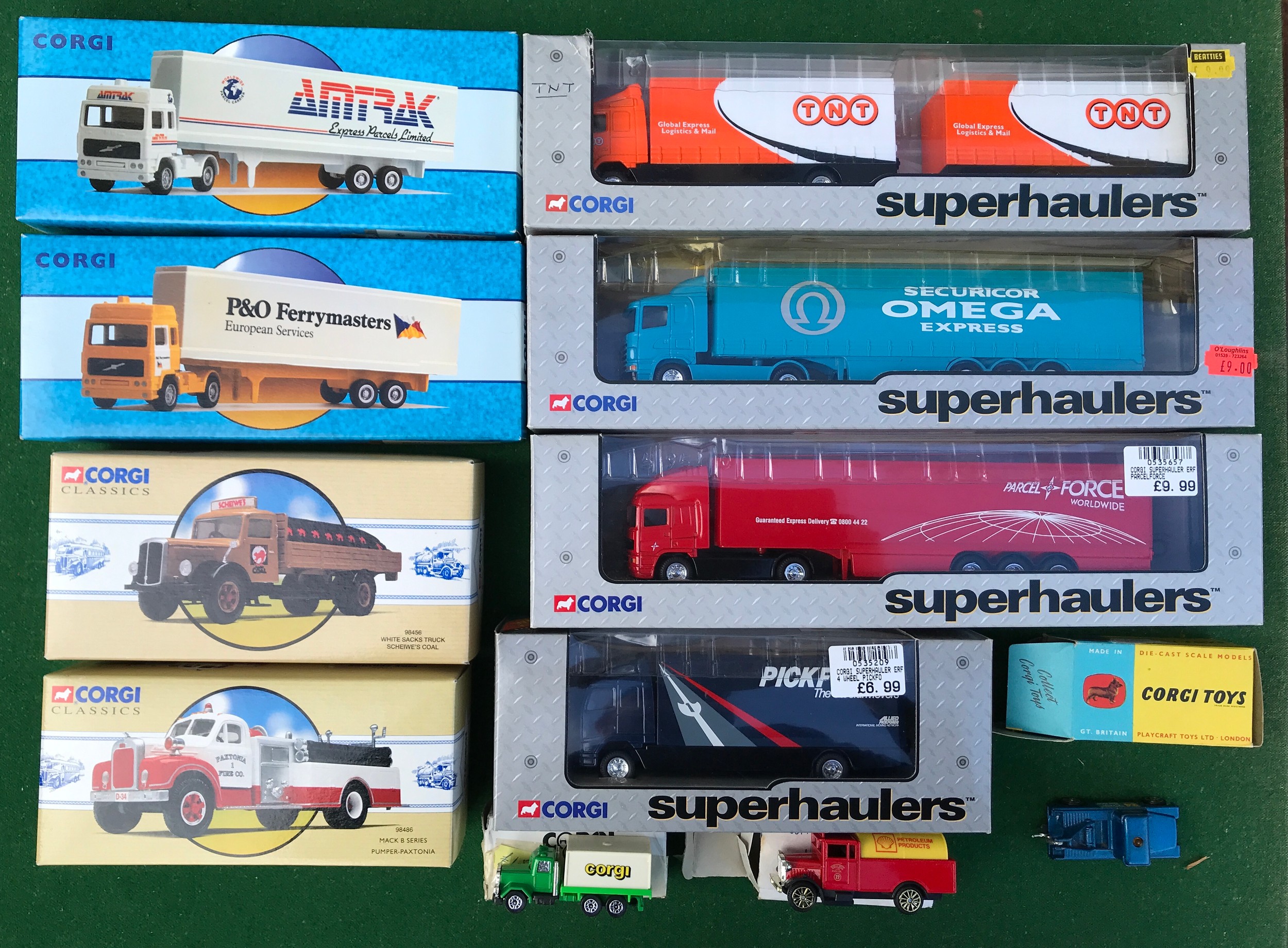 Corgi diecast vehicles to include 98486 Mack B Series Pomper, 98456 White Sacks Truck, 98103 Volvo