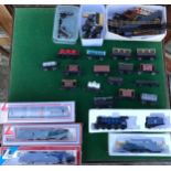 A collection of diecast model trains, carriages and miscellaneous train set parts from brands