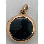 A 19thC locket with bloodstone to one side and onyx to other side. Tests as 9ct front and back.
