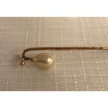 A cased 9ct gold and pearl tie pin. 6cm l.Condition ReportGood condition.
