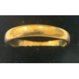 A 22ct gold wedding band. Size M. Weight 3gm.Condition ReportSurface scratches.