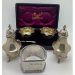 Boxed silver salts and one spoon Sheffield 1902 Atkin Bros, a pair of pepperettes Birmingham 1913