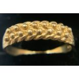 A 9 carat gold dress ring, size W. 4 gm.Condition ReportSome wear to band.