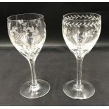 Two matching glass goblets finely etched with differing leaf designs. 20cmCondition ReportNo